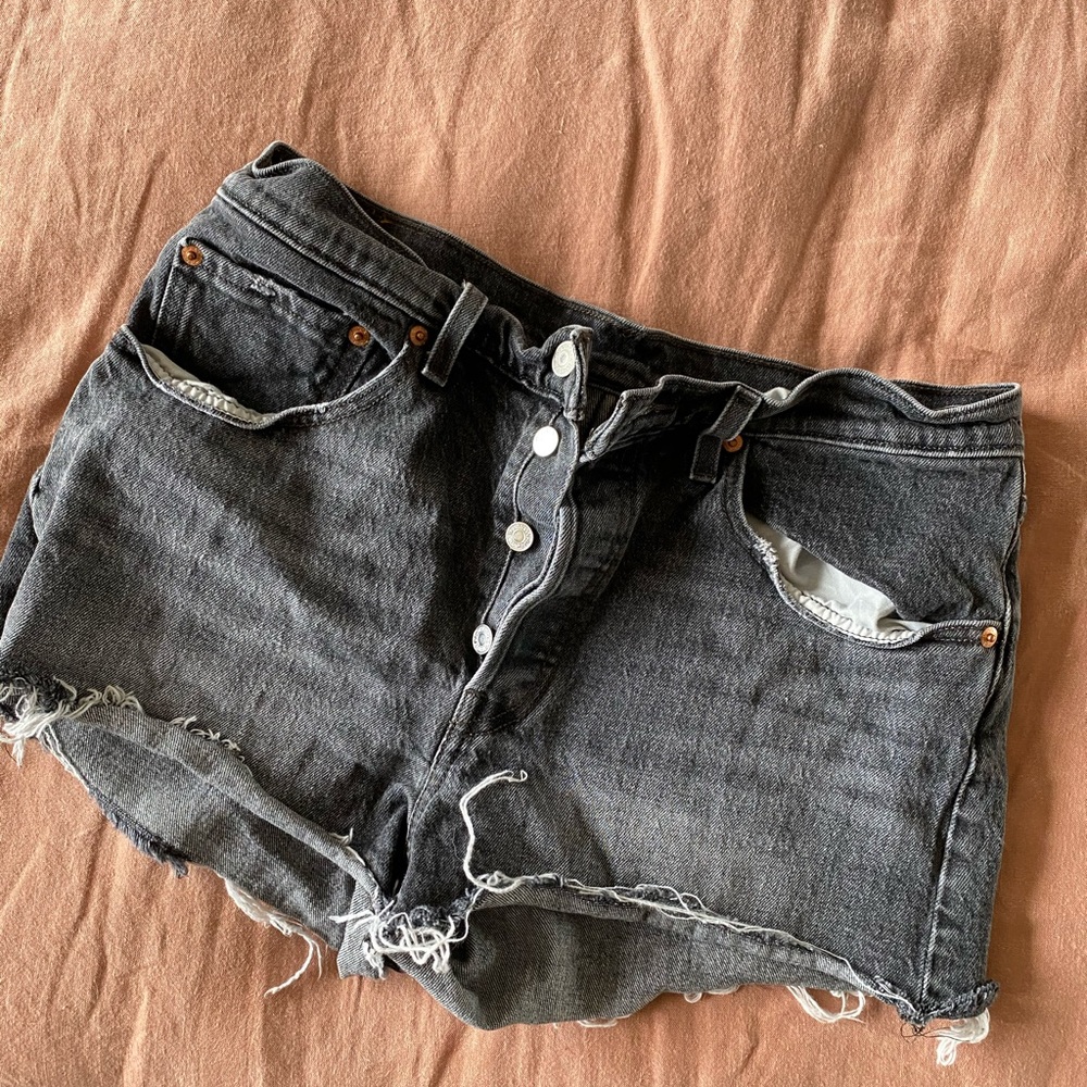 Levi’s black denim washed shorty cutoff short.